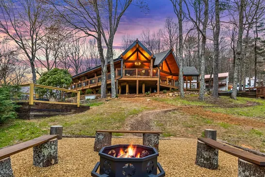 Evening gathering around the firepit outside the lodge